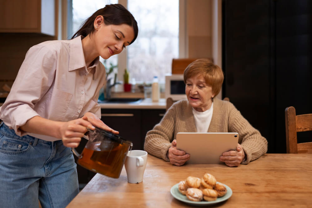 Female caretaker at her client's house taking care of elderly person
