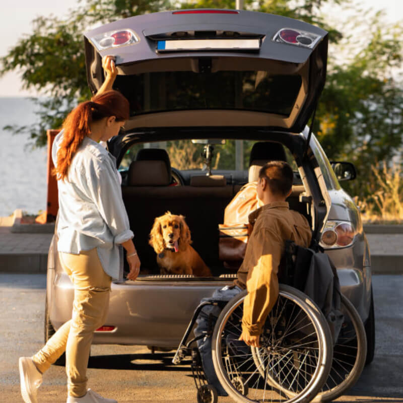 full-shot-people-with-wheelchair-car