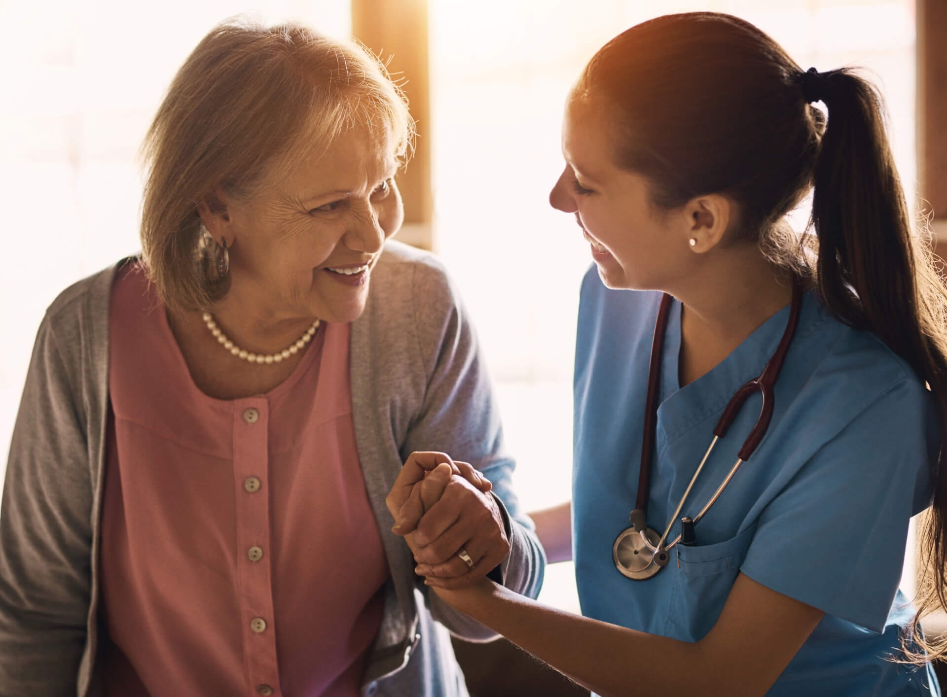 nurse-senior-woman-holding-hands-support-smile-comfort-with-happiness-bonding-together-healthcare-caregiver-patient-old-lady-with-wellness-compassion-consultation-home